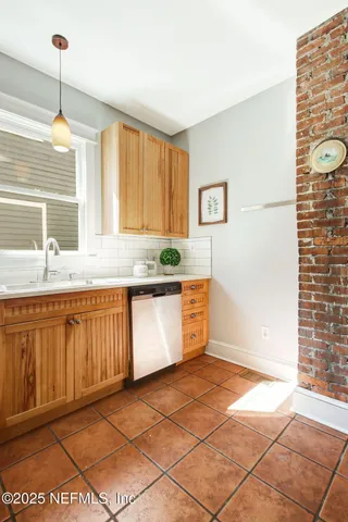 a kitchen with stainless steel appliances granite countertop a sink and a granite counter tops