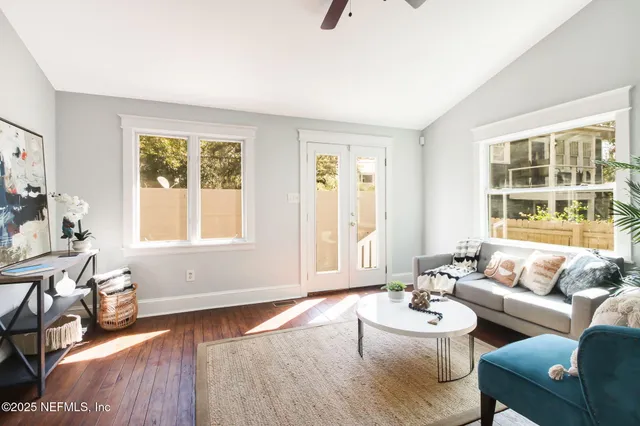 a living room with furniture and a window