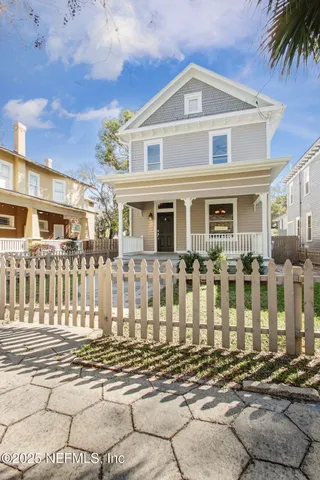 a front view of a house with a street