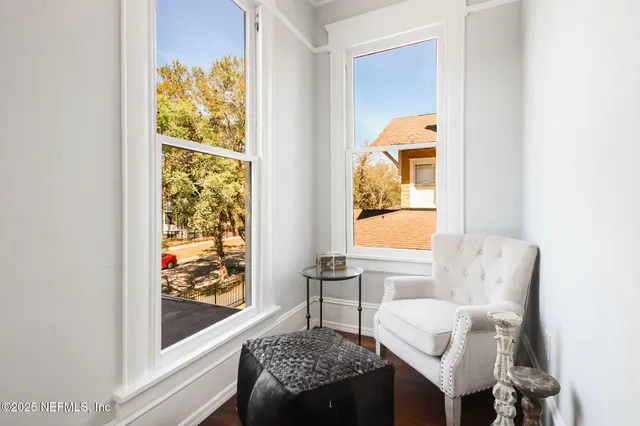 a living room with furniture and a window