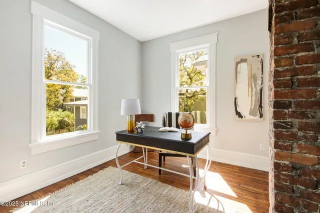 a workspace with furniture and a window