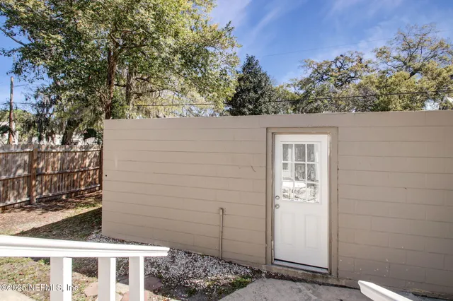 a view of house with yard
