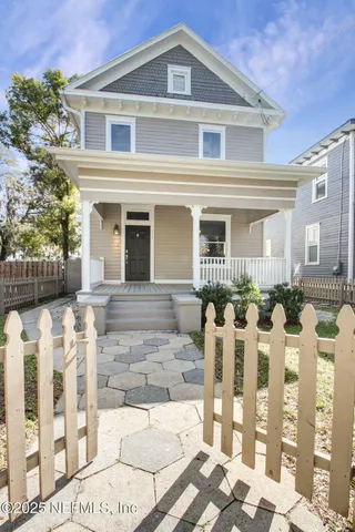 a front view of a house with glass windows
