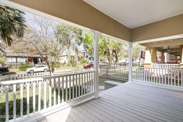 a view of a porch with wooden floor