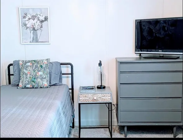 a view of room with furniture and flat screen tv