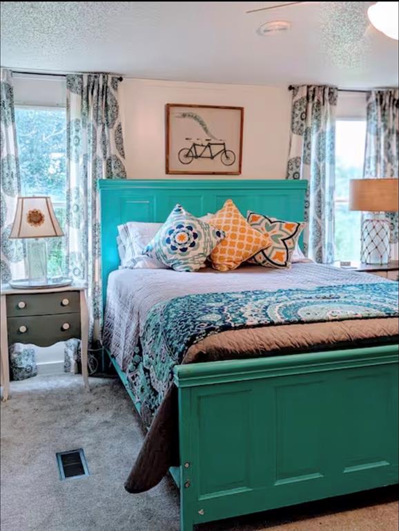 1075 1st Street Hawley, TX 79525 - Photo 19 of 20 a bed sitting in a bedroom next to a window