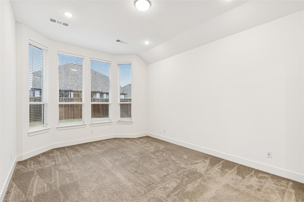 1144 Saddle Ridge Drive Aubrey, TX 76227 - Photo 12 of 34 an empty room with a window