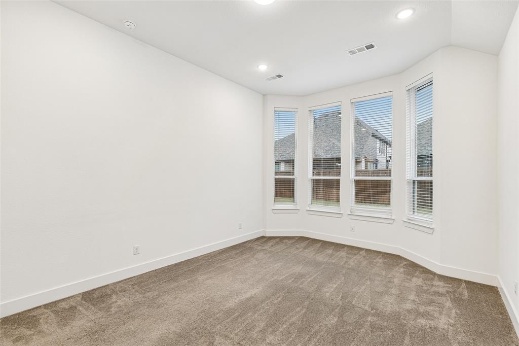 1144 Saddle Ridge Drive Aubrey, TX 76227 - Photo 13 of 34 an empty room with a window
