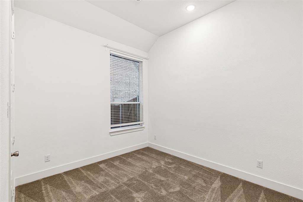 1144 Saddle Ridge Drive Aubrey, TX 76227 - Photo 20 of 34 an empty room with a window