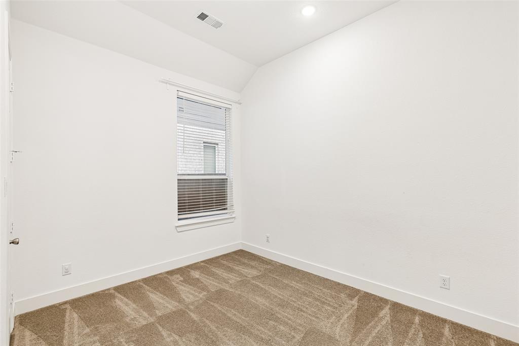 1144 Saddle Ridge Drive Aubrey, TX 76227 - Photo 24 of 34 a view of an empty room with a window