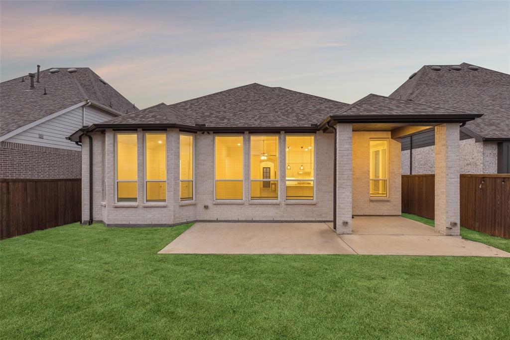 1144 Saddle Ridge Drive Aubrey, TX 76227 - Photo 27 of 34 a view of front of a house with a yard