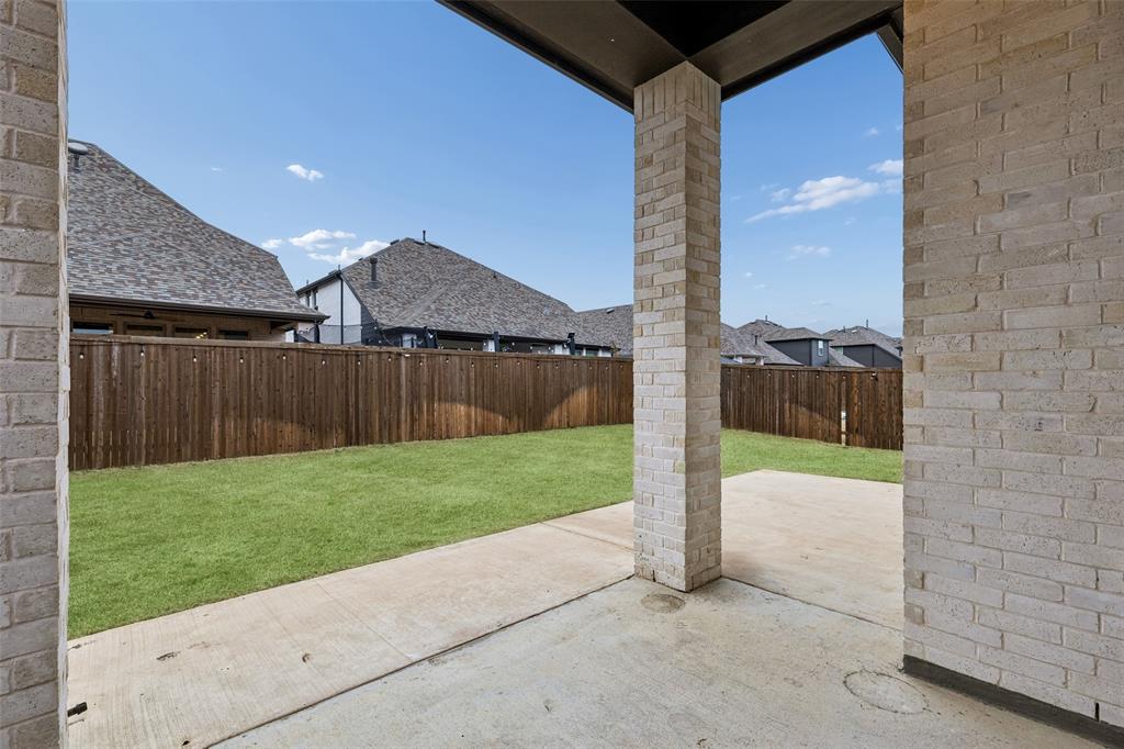 1144 Saddle Ridge Drive Aubrey, TX 76227 - Photo 30 of 34 a view of a backyard with barn