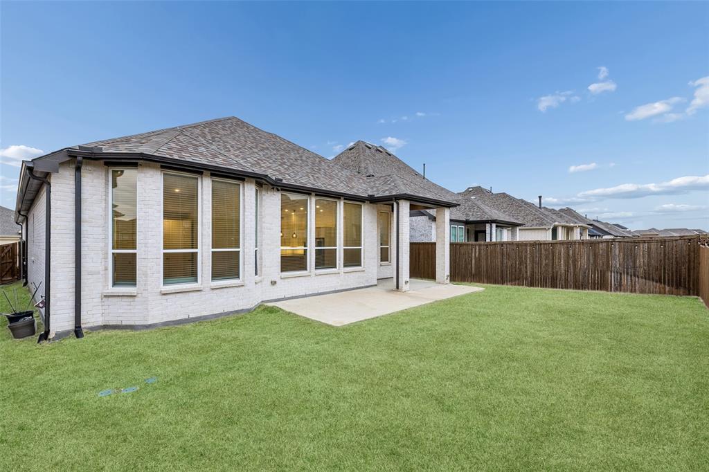 1144 Saddle Ridge Drive Aubrey, TX 76227 - Photo 31 of 34 a view of an house that has garden