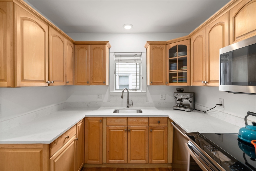 26 Edgebrook Road Boston, MA 02132 - Photo 12 of 30 a kitchen with a sink cabinets and window