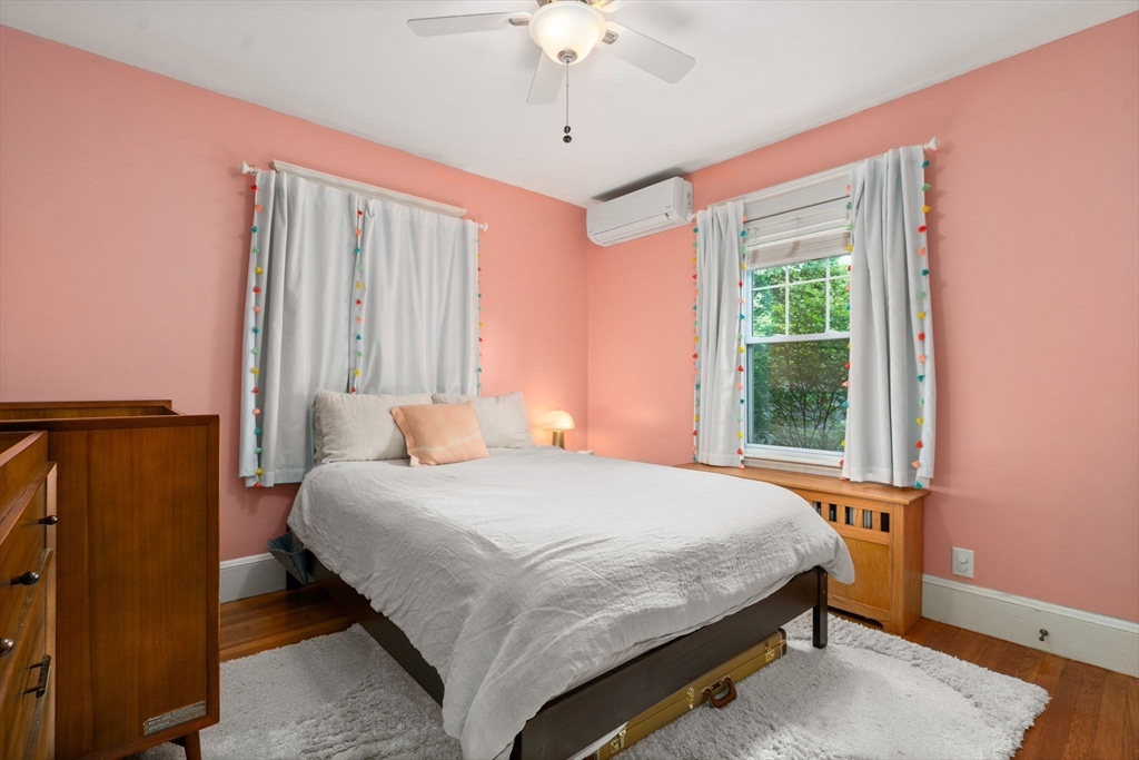 26 Edgebrook Road Boston, MA 02132 - Photo 14 of 30 a bedroom with a bed dresser and a window