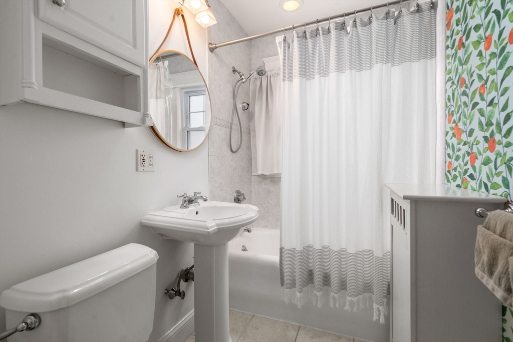 26 Edgebrook Road Boston, MA 02132 - Photo 16 of 30 a bathroom with a sink a toilet and a mirror