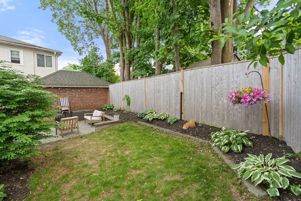 26 Edgebrook Road Boston, MA 02132 - Photo 27 of 30 a front view of a house with a yard and sitting area