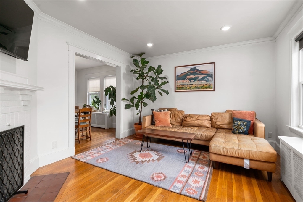 26 Edgebrook Road Boston, MA 02132 - Photo 3 of 30 a living room with furniture and a flat screen tv
