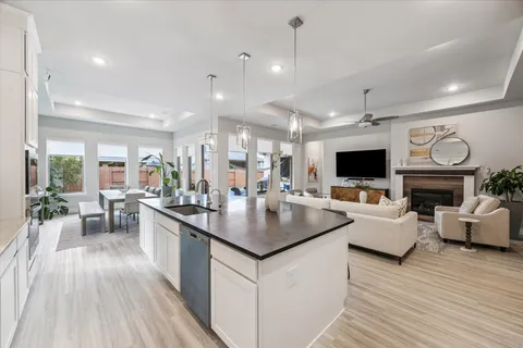 a kitchen with living room and living room view
