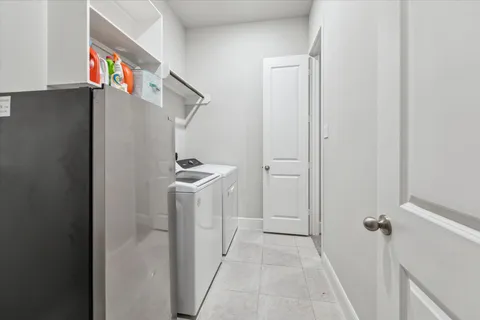 a view of hallway with washer and dryer