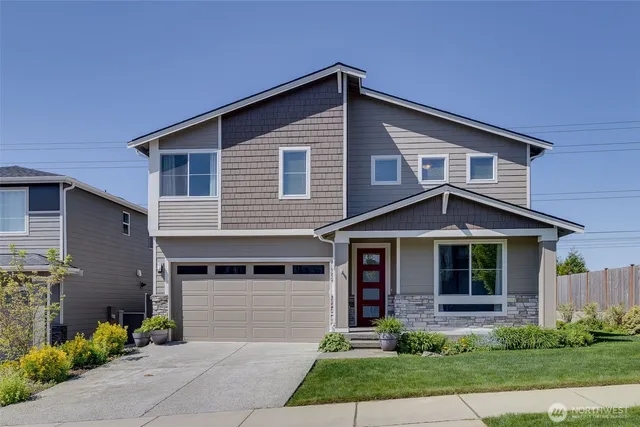 a front view of a house with garden