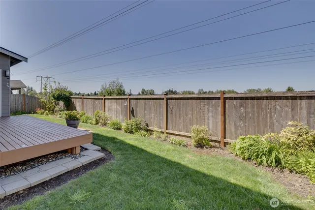 a view of a backyard with sitting area