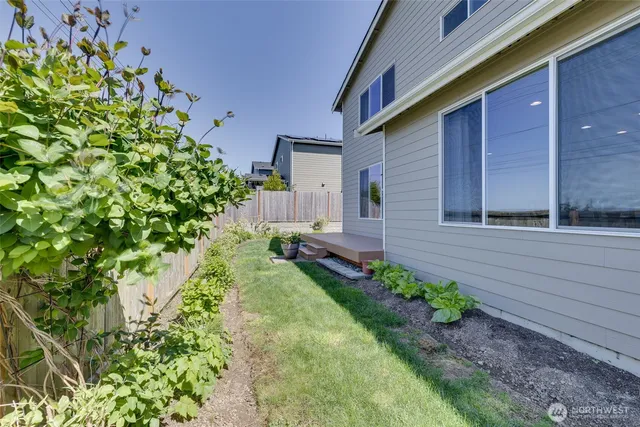 a backyard of a house with lots of green space