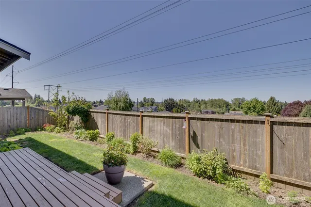 a view of a lake with a table and a chair