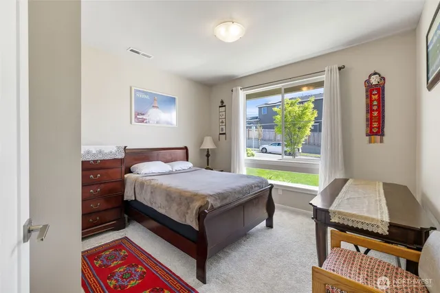 a bed room with a bed and a window