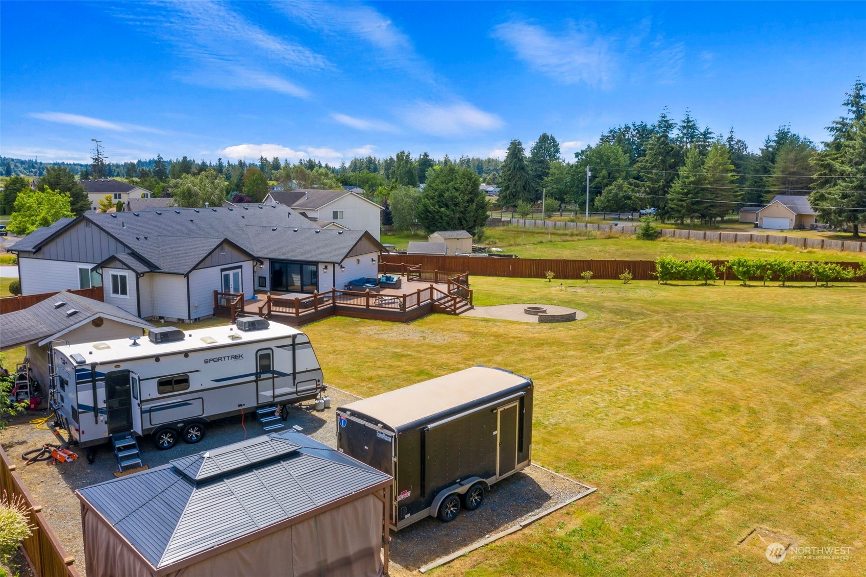 4742 181st Lane Southwest Rochester, WA 98579 - Photo 3 of 40 a view of a swimming pool with lounge chairs in patio