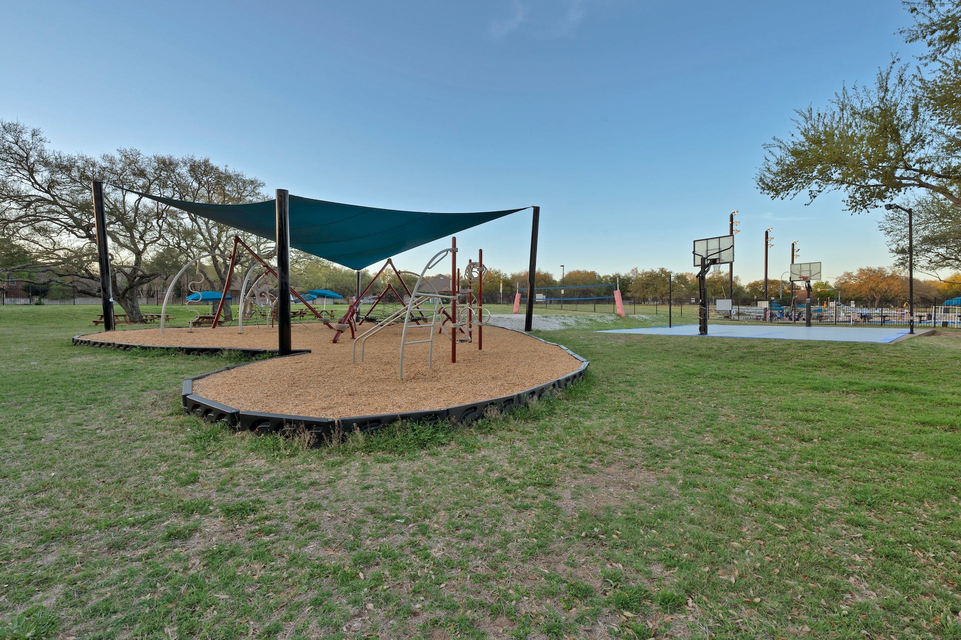 11129 Bastogne Loop Austin, TX 78739 - Photo 37 of 40 The main Swim Center park offers a modern, shaded playground, basketball, and sand volleyball courts.