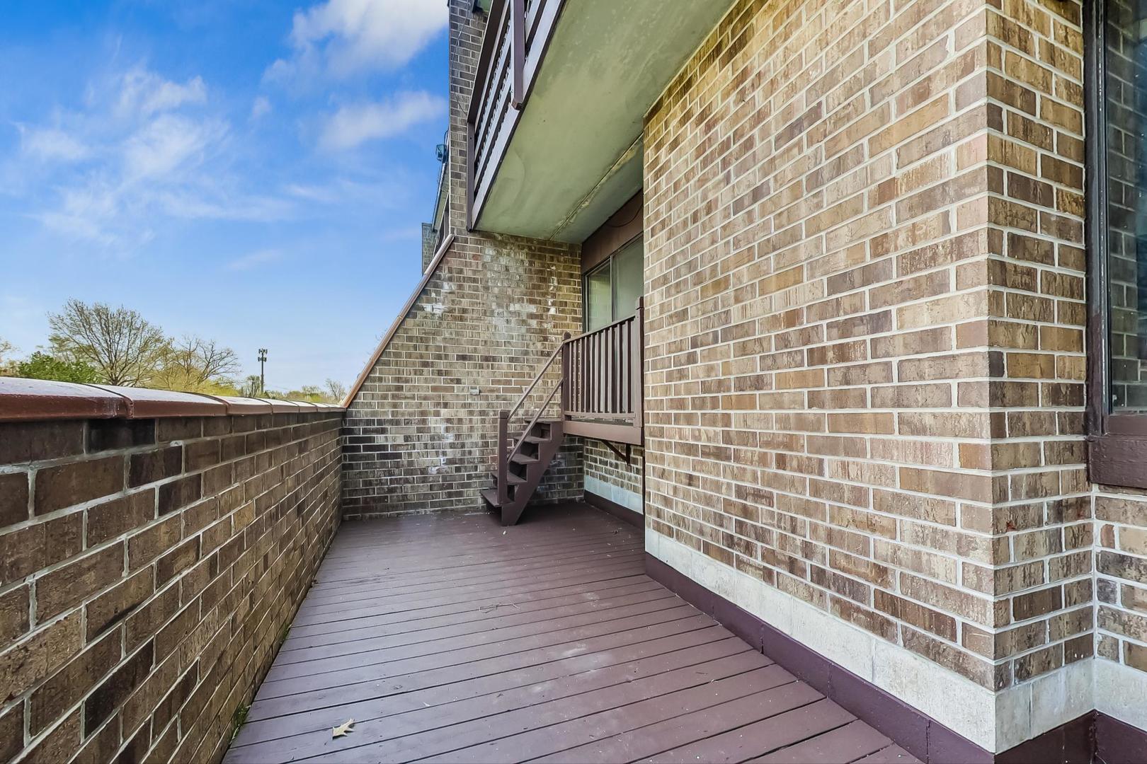 102 Kenneth Circle Elgin, IL 60120 - Photo 12 of 33 a view of terrace with wooden floor and cabinet