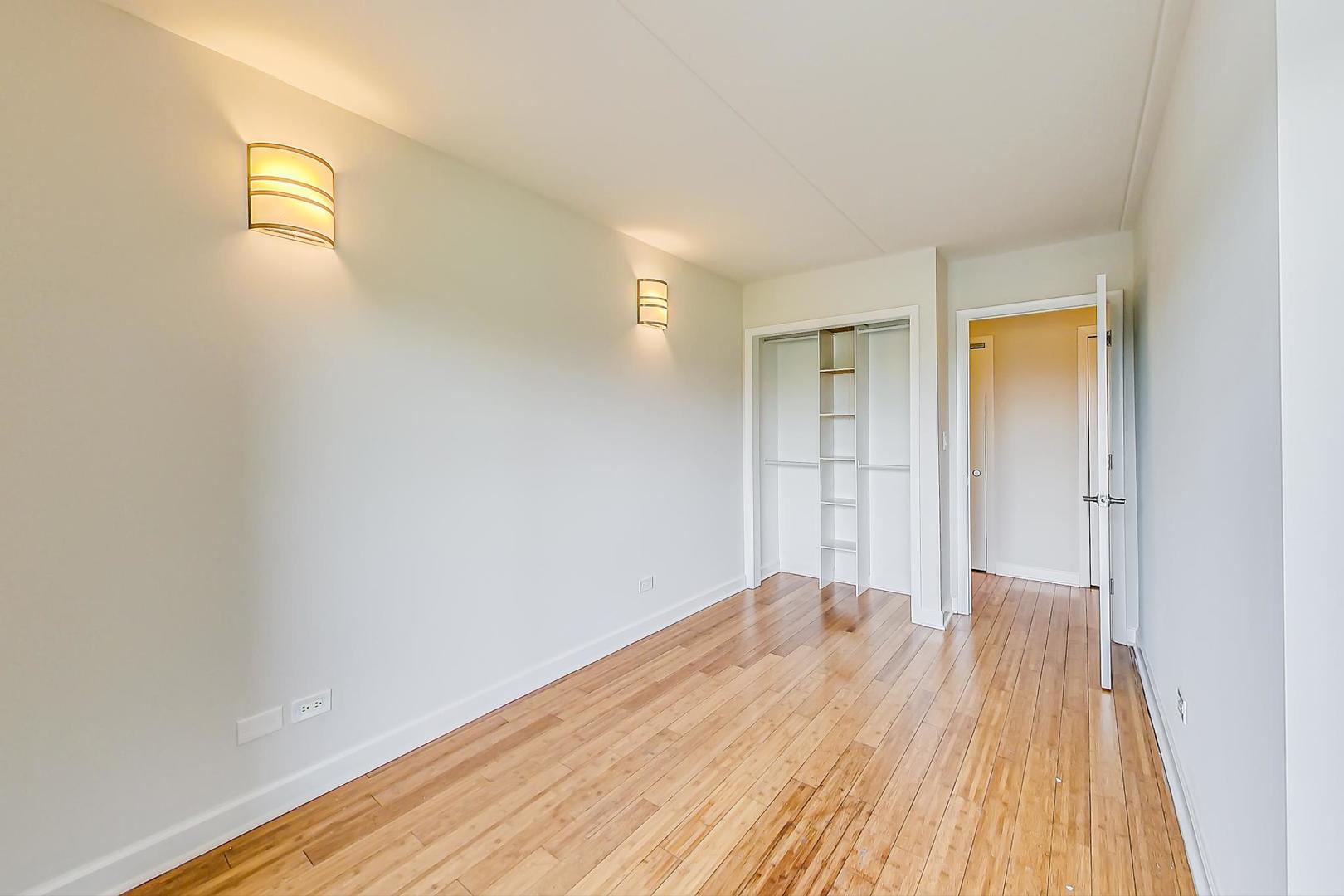 102 Kenneth Circle Elgin, IL 60120 - Photo 17 of 33 a view of a room with wooden floor and a bathroom
