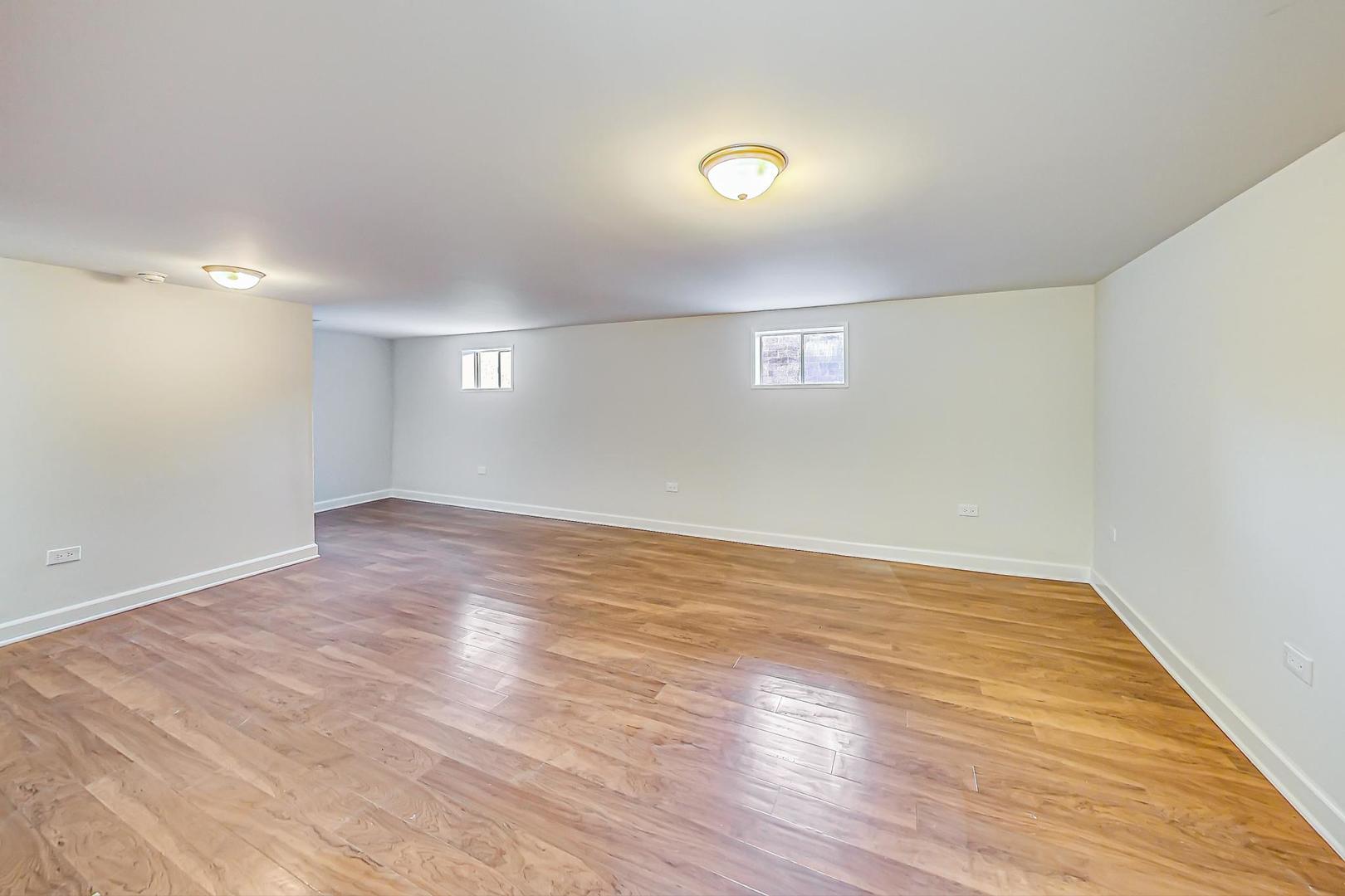 102 Kenneth Circle Elgin, IL 60120 - Photo 23 of 33 a view of empty room with wooden floor