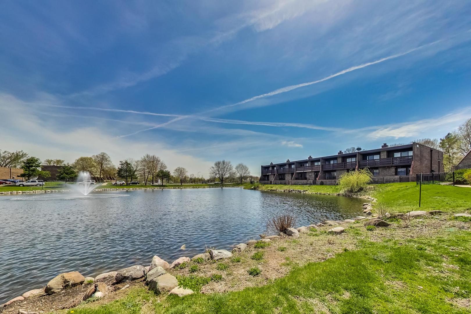 102 Kenneth Circle Elgin, IL 60120 - Photo 26 of 33 a view of a lake with houses in the background