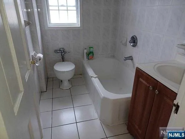 a bathroom with a sink a toilet and bathtub