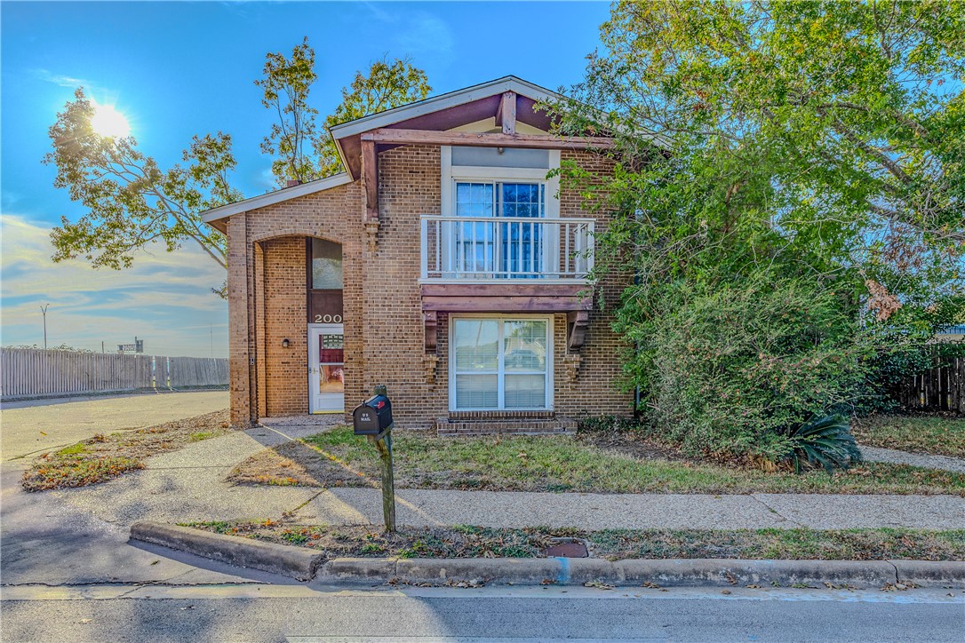 2002 South Lubbock Street Brenham, TX 77833 - Photo 26 of 26 Traditional-style home with brick siding and a balcony
