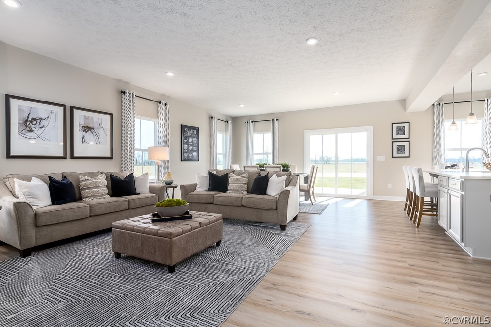 621 Marsham Road Chester, VA 23836 - Photo 6 of 16 a living room with furniture and a wooden floor