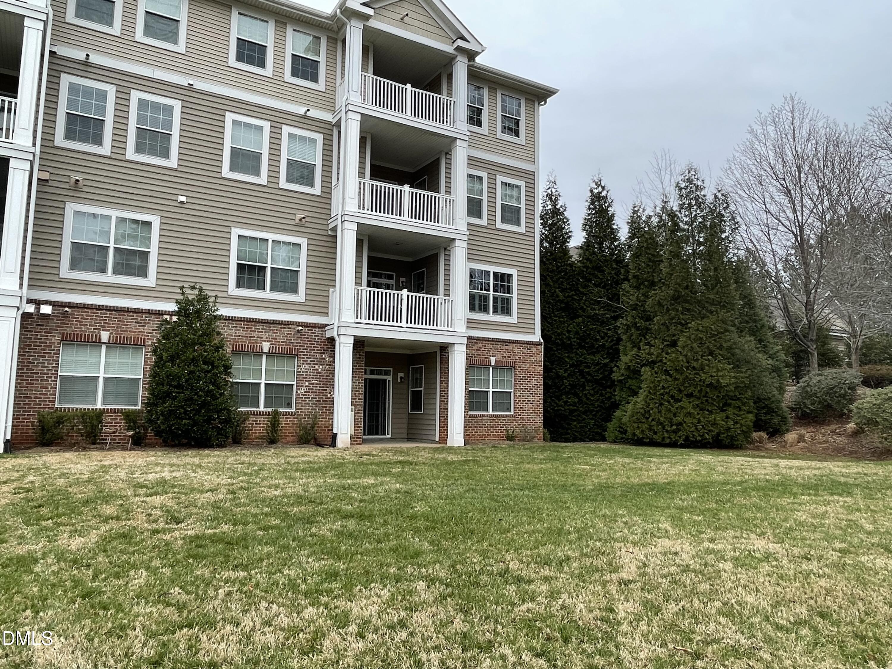 10411 Rosegate Court, Unit 3 Raleigh, NC 27617 - Photo 21 of 62 a view of a building with a yard