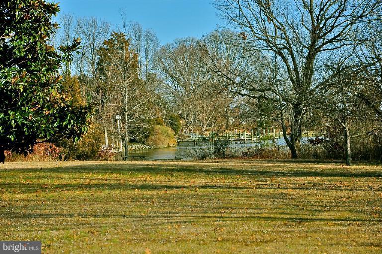 779 Masons Beach Road Deale, MD 20751 - Photo 1 of 14 a view of a swimming pool with a trees