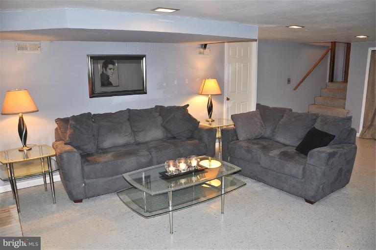 779 Masons Beach Road Deale, MD 20751 - Photo 13 of 14 a living room with furniture and a lamp