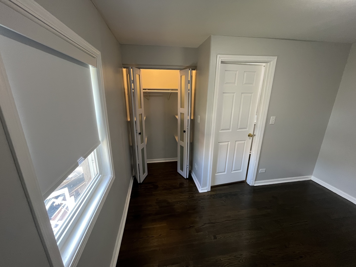 1249 South Kolin Avenue, Unit 1 Chicago, IL 60623 - Photo 18 of 20 a view of a hallway with wooden floor and a window