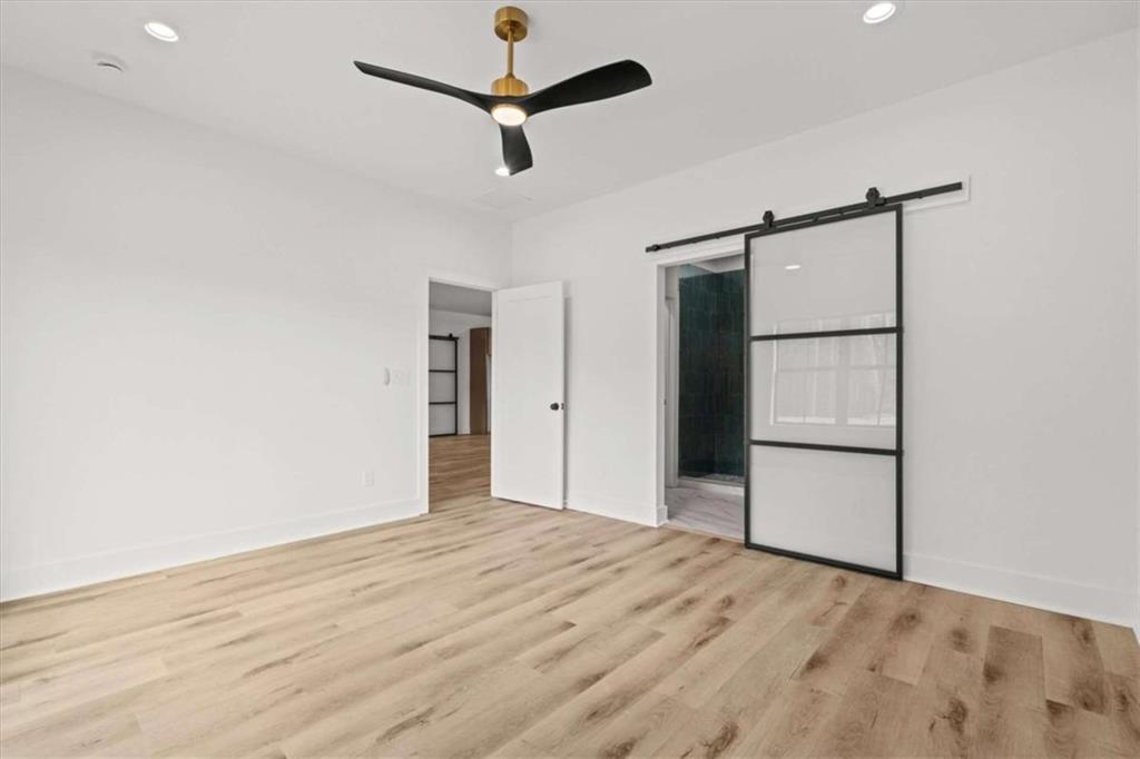 415 Lively Road Waco, GA 30182 - Photo 20 of 49 a view of empty room with wooden floor and ceiling fan