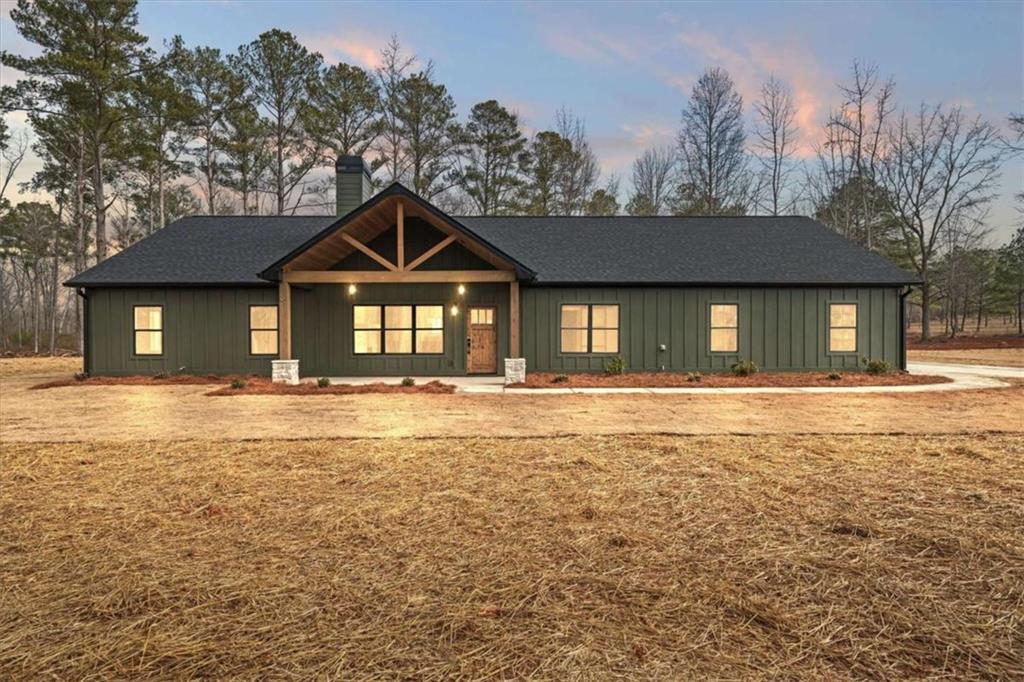 415 Lively Road Waco, GA 30182 - Photo 2 of 49 a front view of a house with a yard