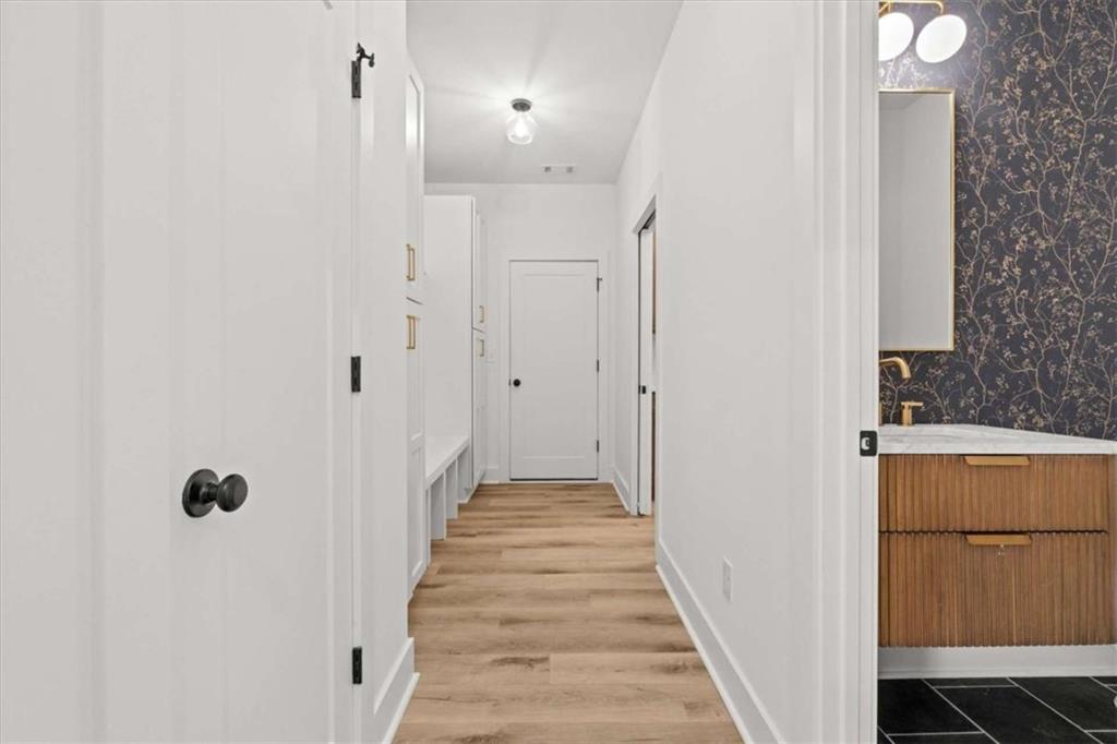 415 Lively Road Waco, GA 30182 - Photo 28 of 49 a view of a hallway with wooden floor and staircase