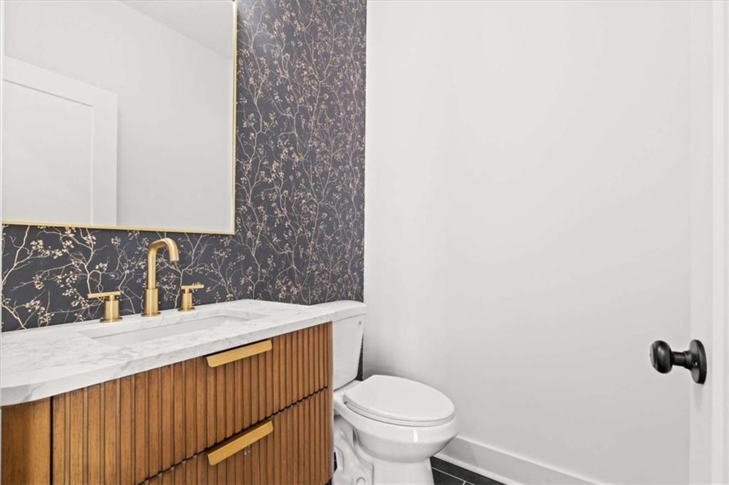 415 Lively Road Waco, GA 30182 - Photo 29 of 49 a bathroom with a sink a toilet and mirror