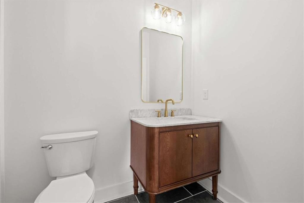 415 Lively Road Waco, GA 30182 - Photo 33 of 49 a bathroom with a toilet a sink and mirror