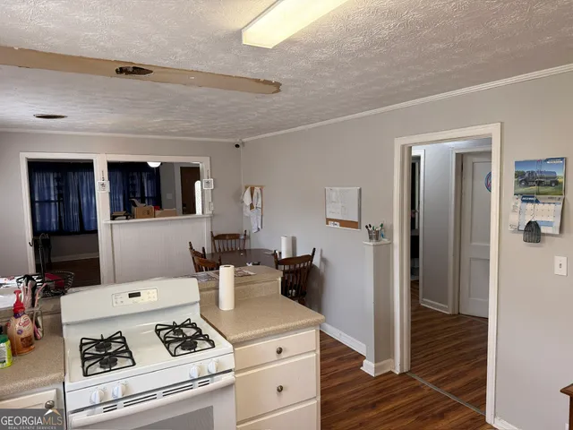 a living room with furniture a desk and chair