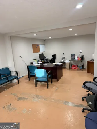 a workspace with furniture and a wooden floor