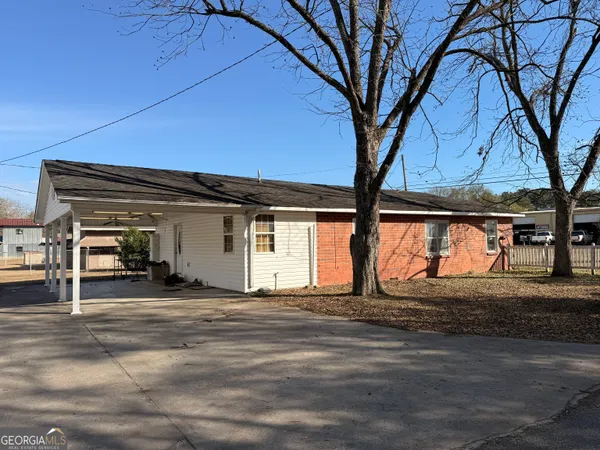 a view of a house with a tree